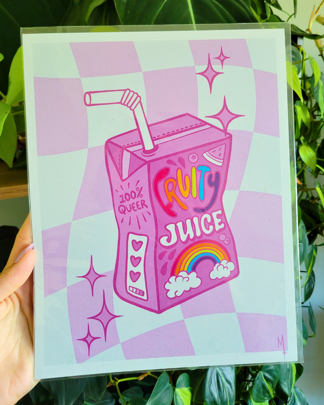 Design of a pink juice box design featuring rainbow text that says 'Fruity Juice' against a purple checkered background.