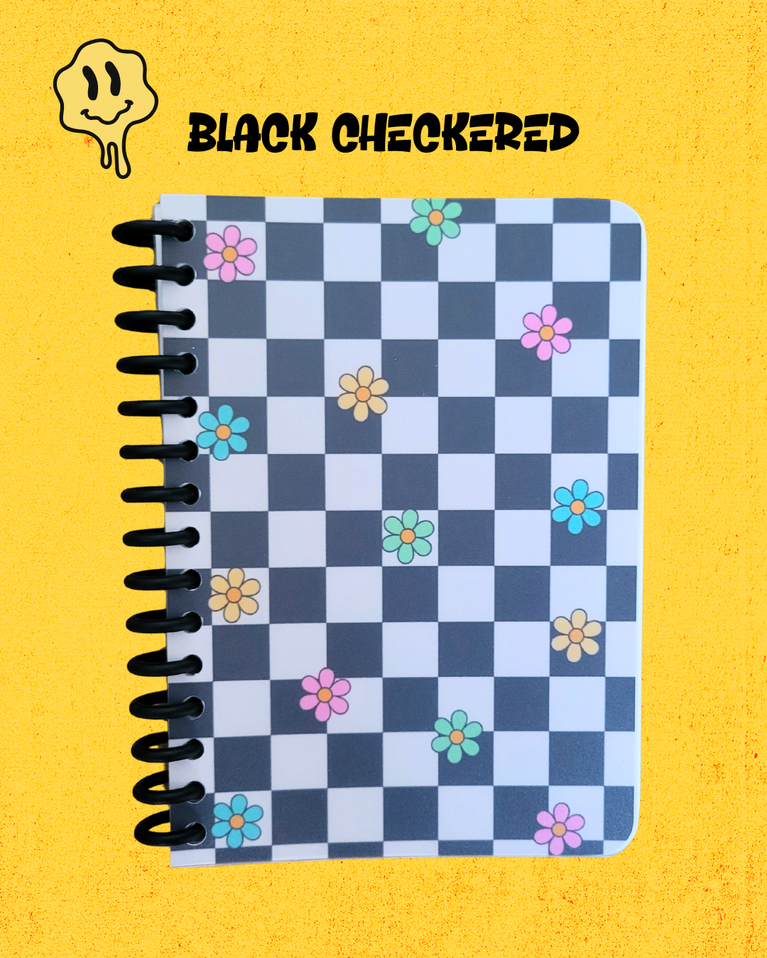 Checkered notebook with flowers on a yellow background, featuring the brand 'Black Checkered'.