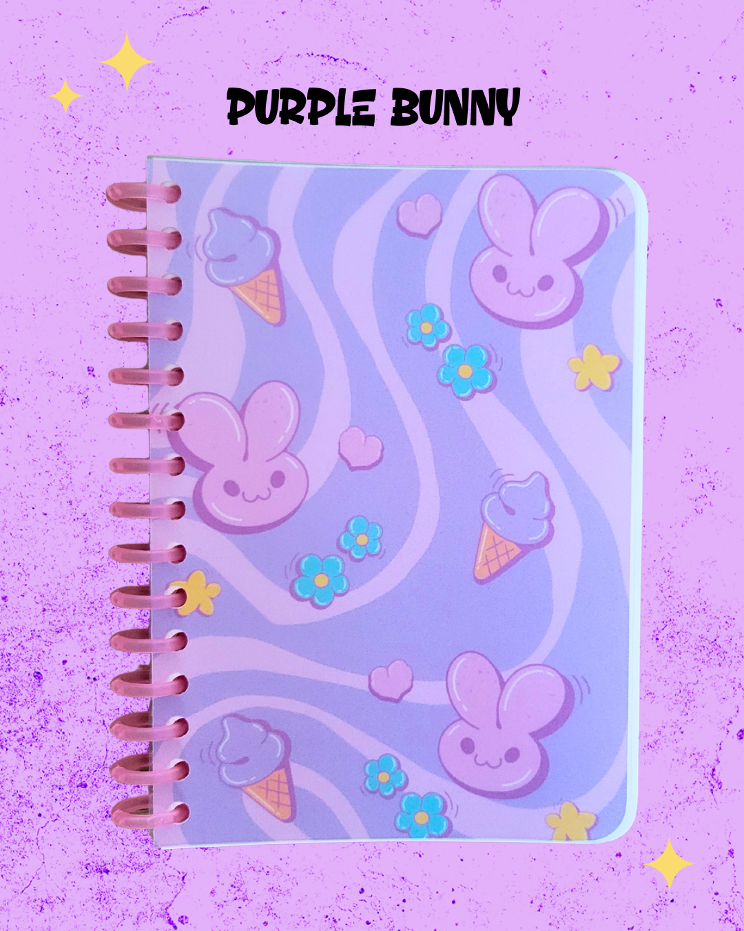 Notebook with purple bunny and ice cream designs on a purple background