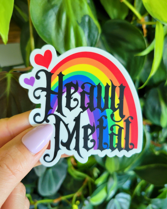 Sticker with  a pride rainbow and 'Heavy Metal' text overtop