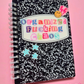 Notebook with colorful text that says "Organized Fucking Chaos" on a pink background