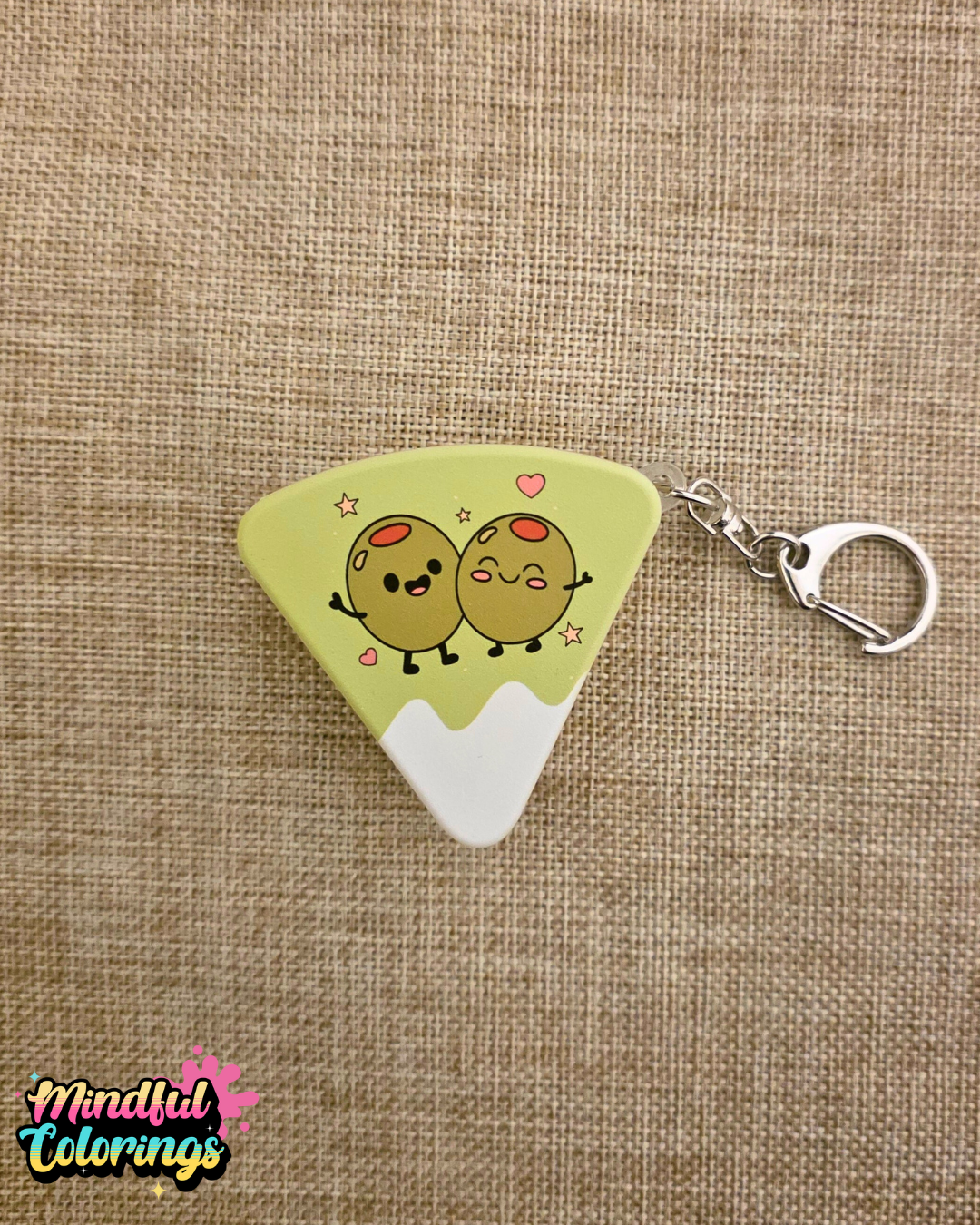 Cheese shaped fidget keychain with cartoon olives on the front