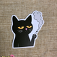 Sticker of a black cat smoking a cigarette on a textured brown background