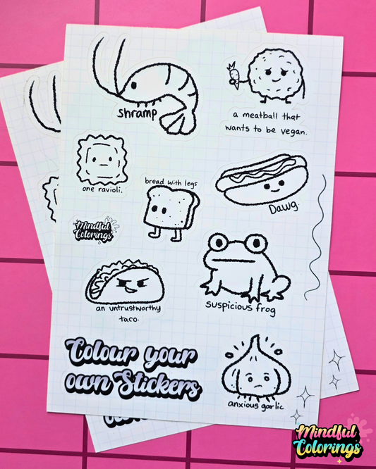 Colour-your-own vinyl sticker sheet featuring quirky characters including Suspicious Frog, Anxious Garlic, Bread With Legs, Shramp, One Ravioli, Dawg, an Untrustworthy Taco, and a Meatball That Wants to Be Vegan.