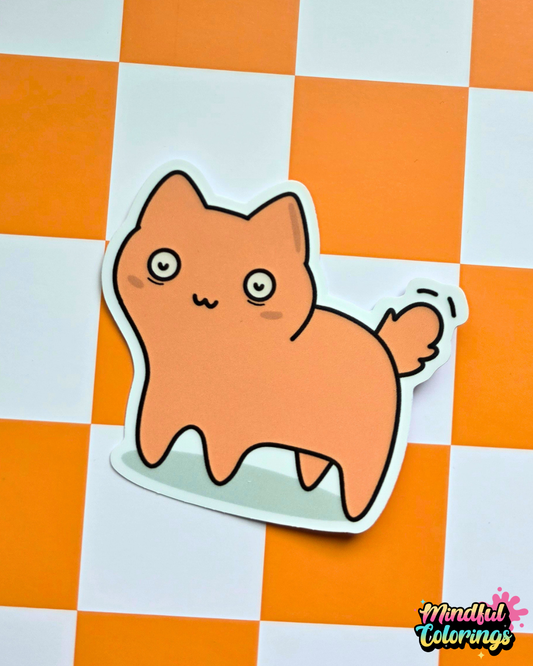 Waterproof vinyl sticker featuring a chubby peach-colored cat with wide eyes on an orange checkered background.