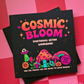 Workbook titled 'Cosmic Bloom Emotional Detox Workbook' with mushroom and alien imagery on a pink checkered background