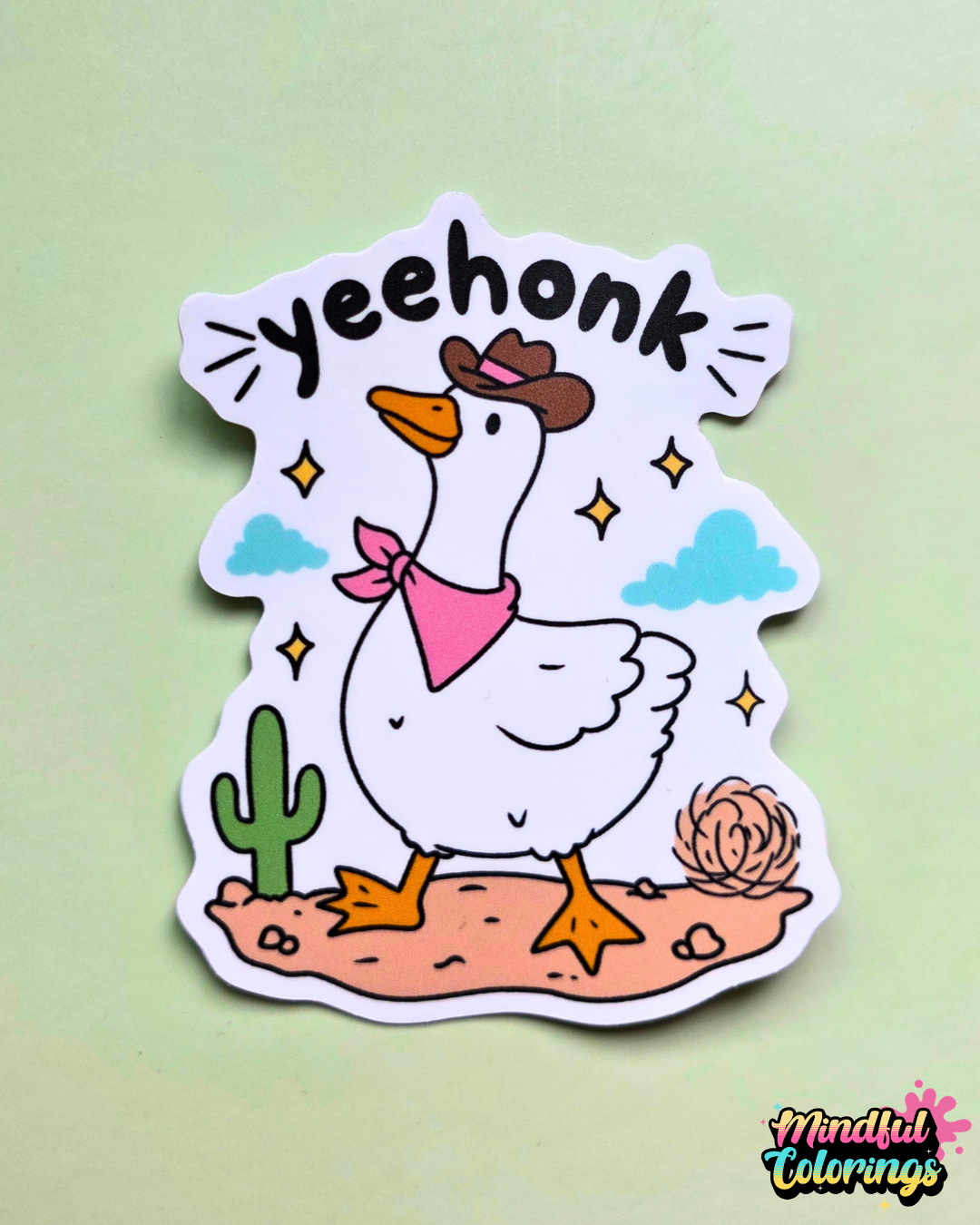 Waterproof vinyl sticker featuring a goose wearing a cowboy hat and pink bandana with the word "Yeehonk" above on a soft green backgroun