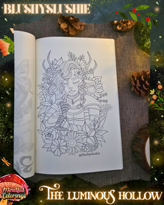 Open colouring journal displaying a fantasy portrait of a horned woodland knight character surrounded by flowers, leaves, and botanical details, featured inside The Luminous Hollow Anxiety Colouring Journal.