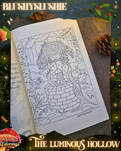 Open colouring journal displaying a whimsical woodland illustration of a magical wishing well surrounded by vines, flowers, trees, and enchanted forest details, featured inside The Luminous Hollow Anxiety Colouring Journal.