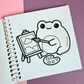 Mini frog-themed colouring book page featuring a creative frog painting a picture on an easel while holding a paintbrush and artist palette.