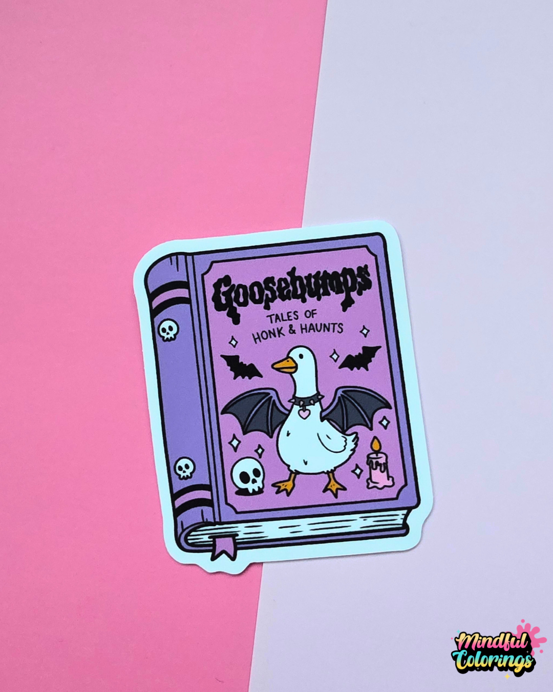 Spooky Goosebumps Tales of Honk and Haunts vinyl sticker featuring a goose with bat wings surrounded by skulls, bats and a candle.