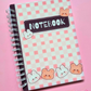 Pink spiral-bound A6 notebook featuring a kawaii checkered cover with cute bunny and bear characters.