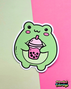 Waterproof vinyl sticker featuring a cute green frog holding a pink bubble tea drink on a pink and mint background.