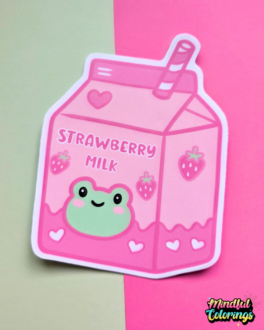 Waterproof vinyl sticker featuring a pink strawberry milk carton with a smiling frog illustration on a pink and mint background.
