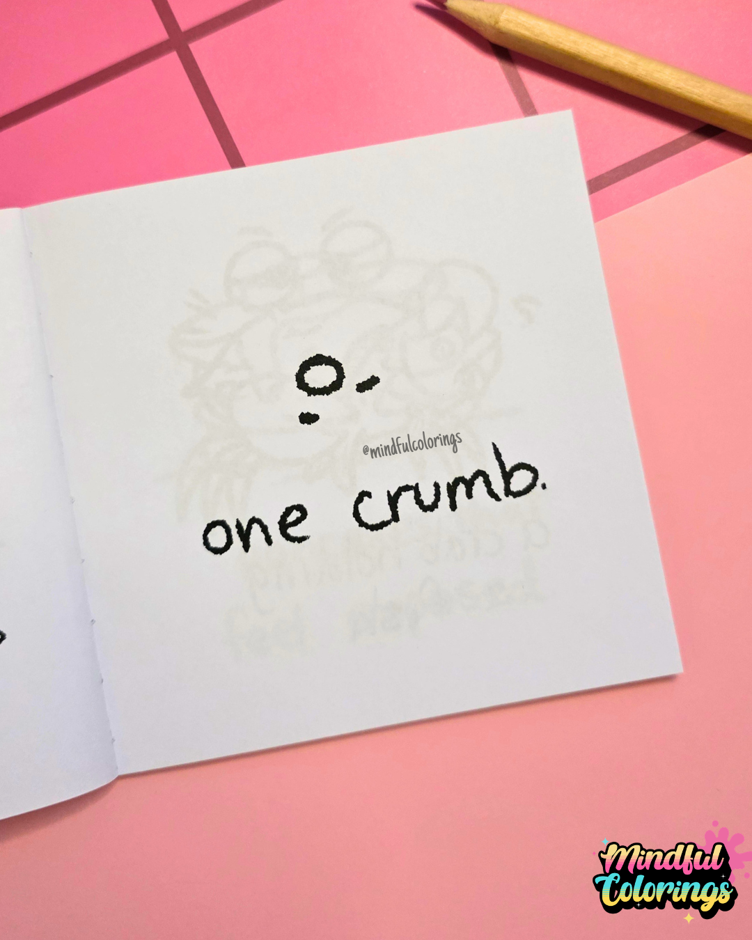 Mini colouring book page featuring a tiny crumb with a face and the caption "one crumb."