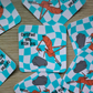 Stickers with the viral Marcus the Worm character crouched next to a rock with the text "Certified Silly Little Guy" with a blue checkered background