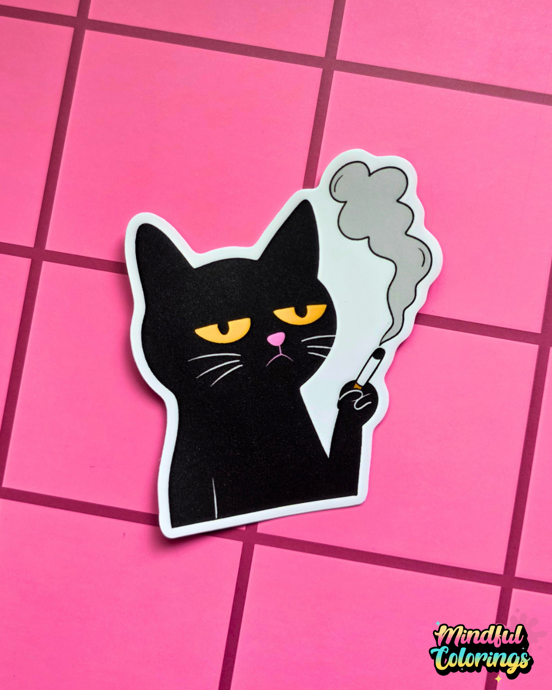 Vinyl sticker featuring a grumpy black cat holding a cigarette with smoke rising above it on a pink checkered background.