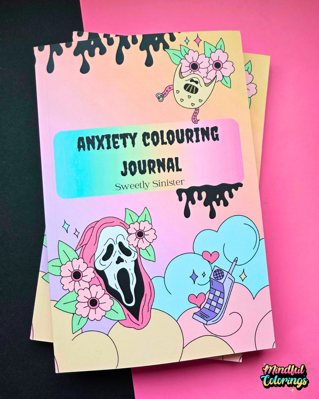 A pastel gradient anxiety colouring journal titled 'ANXIETY COLOURING JOURNAL' by Sweetly Sinister, featuring cartoon illustrations of Horror Character, flowers, clouds, and a phone on a pink and black background.
