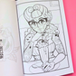 An open coloring book showing a black-and-white illustrated page with a retro-style woman spooky, holding a milkshake, placed on a pink and black background. A 'Mindful Colorings' logo appears in the bottom right corner.