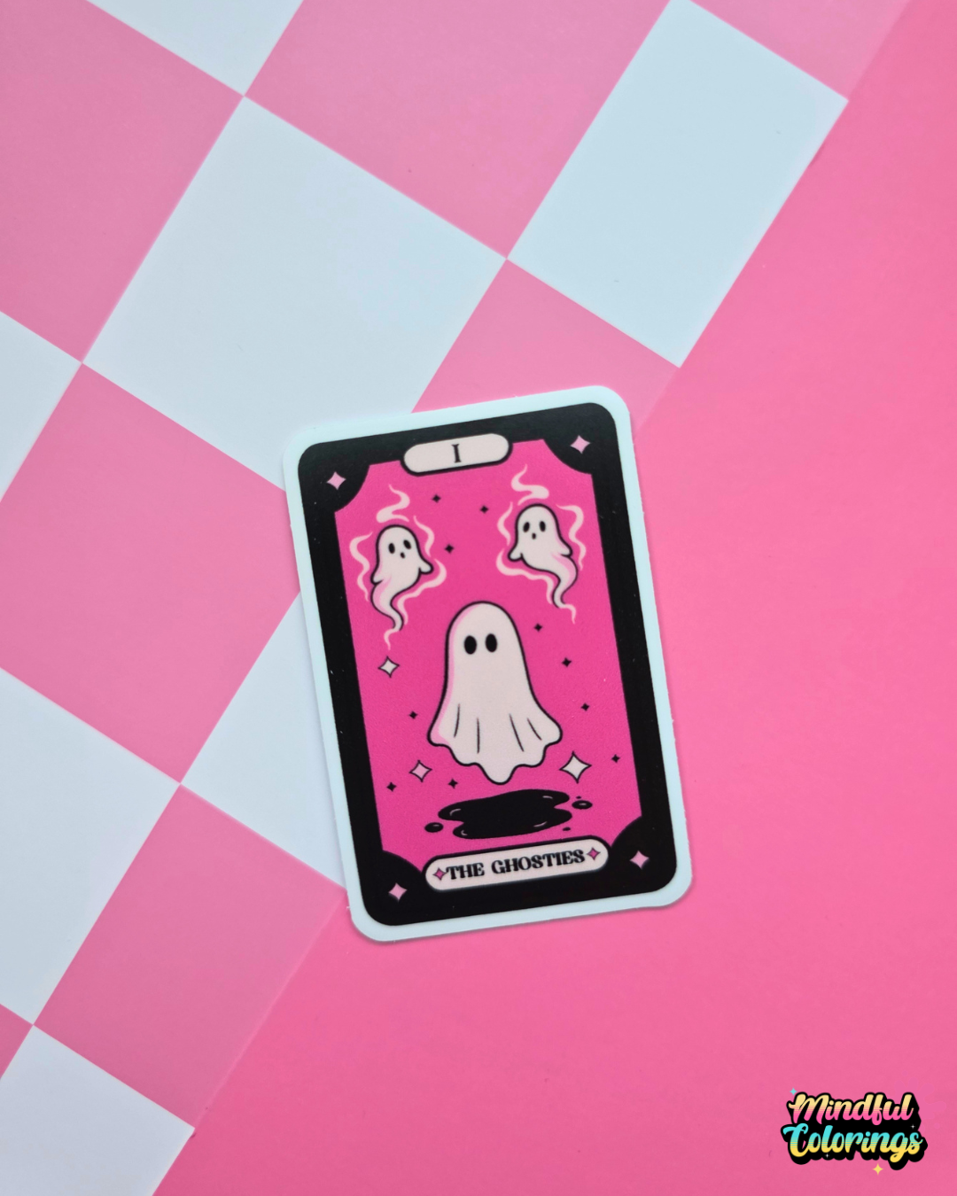Pink tarot-inspired vinyl sticker titled The Ghosties featuring three cute ghosts surrounded by stars and spooky celestial details.