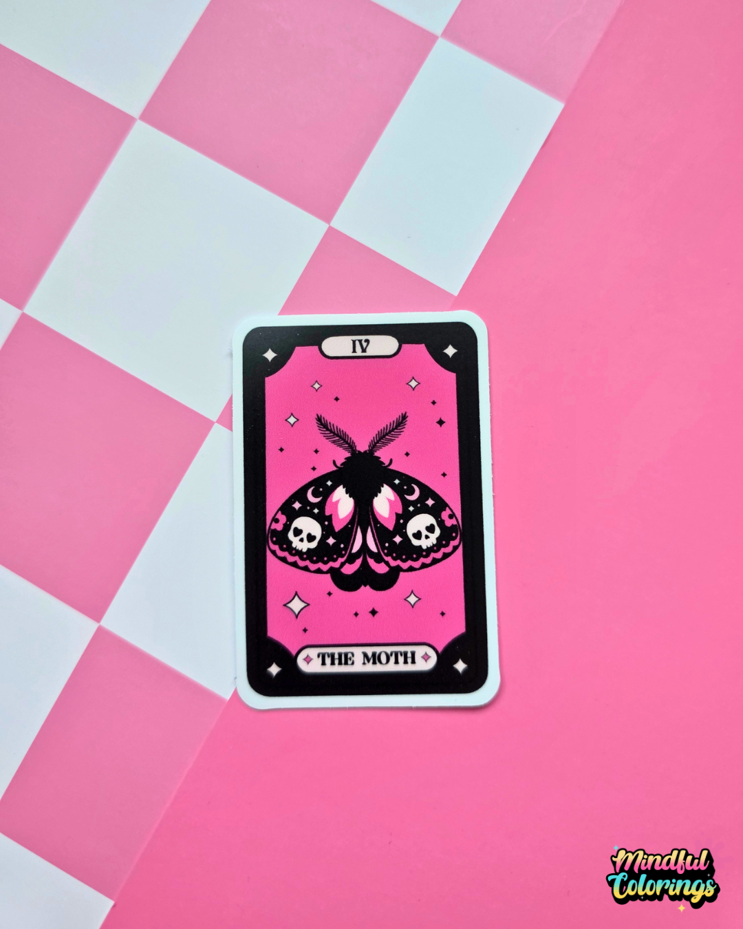 Pink and black tarot-inspired vinyl sticker titled The Moth featuring a gothic moth with skulls, crescent moons and celestial details.