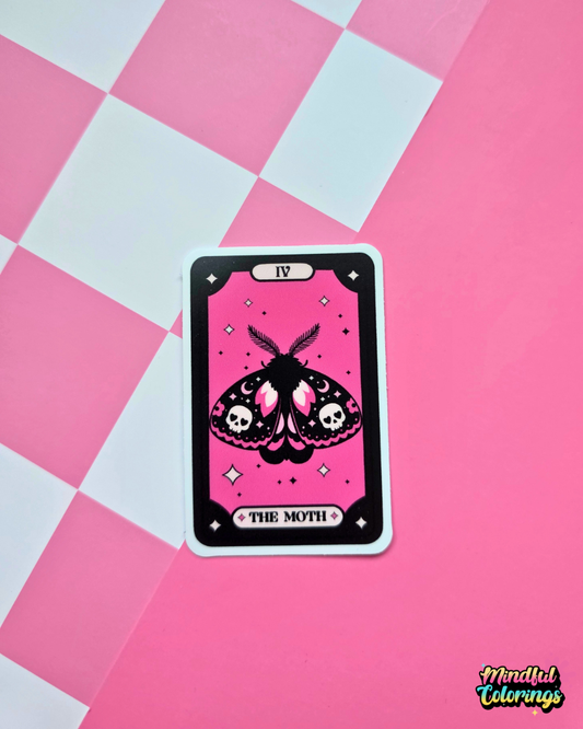 Pink and black tarot-inspired vinyl sticker titled The Moth featuring a gothic moth with skulls, crescent moons and celestial details.
