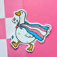 Waterproof matte vinyl sticker featuring a goose wearing a transgender pride flag cape. Cute LGBTQ+ Pride sticker