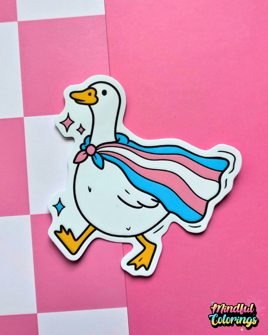 Waterproof matte vinyl sticker featuring a goose wearing a transgender pride flag cape. Cute LGBTQ+ Pride sticker
