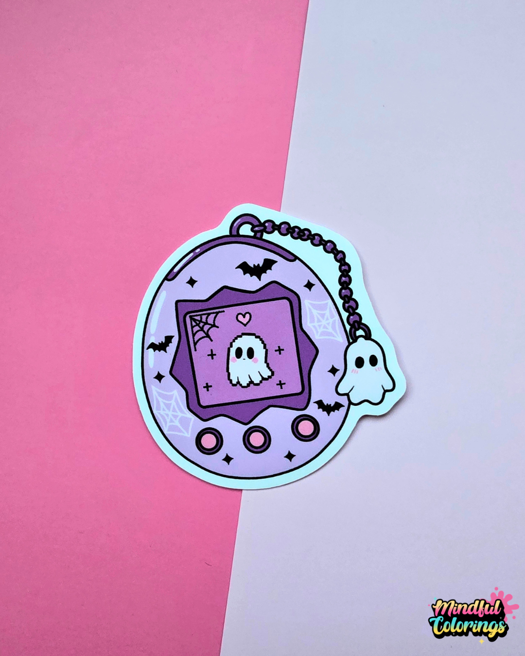 Cute Y2K virtual pet vinyl sticker featuring a pixel ghost inside a purple device with bats, spiderwebs and a tiny ghost charm.