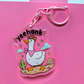 Acrylic keychain featuring a goose wearing a cowboy hat and pink bandana with the word "Yeehonk" on a pink background.