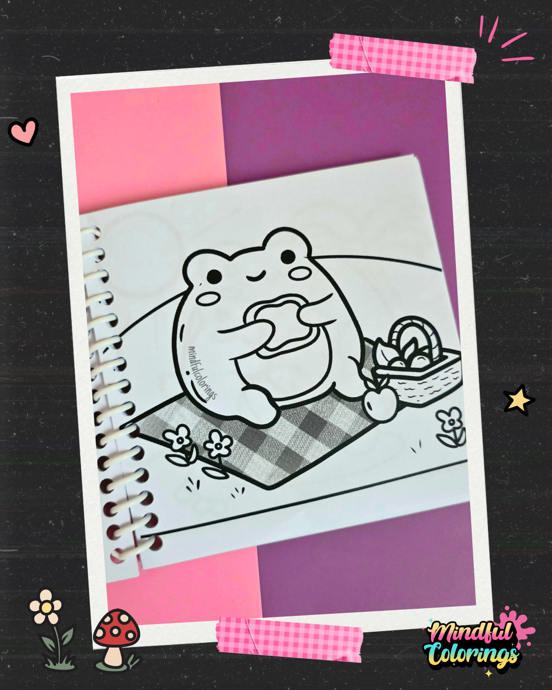 Cute frog enjoying a picnic on a checkered blanket beside a basket of treats coloring page from the Frogcore Adventures mini coloring book.