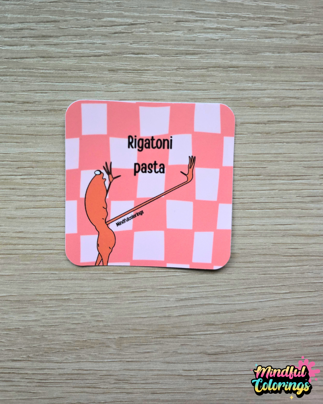 Sticker featuring the viral Marcus the Worm character with his hands raised beside the text "Rigatoni Pasta" on a pink checkered background.